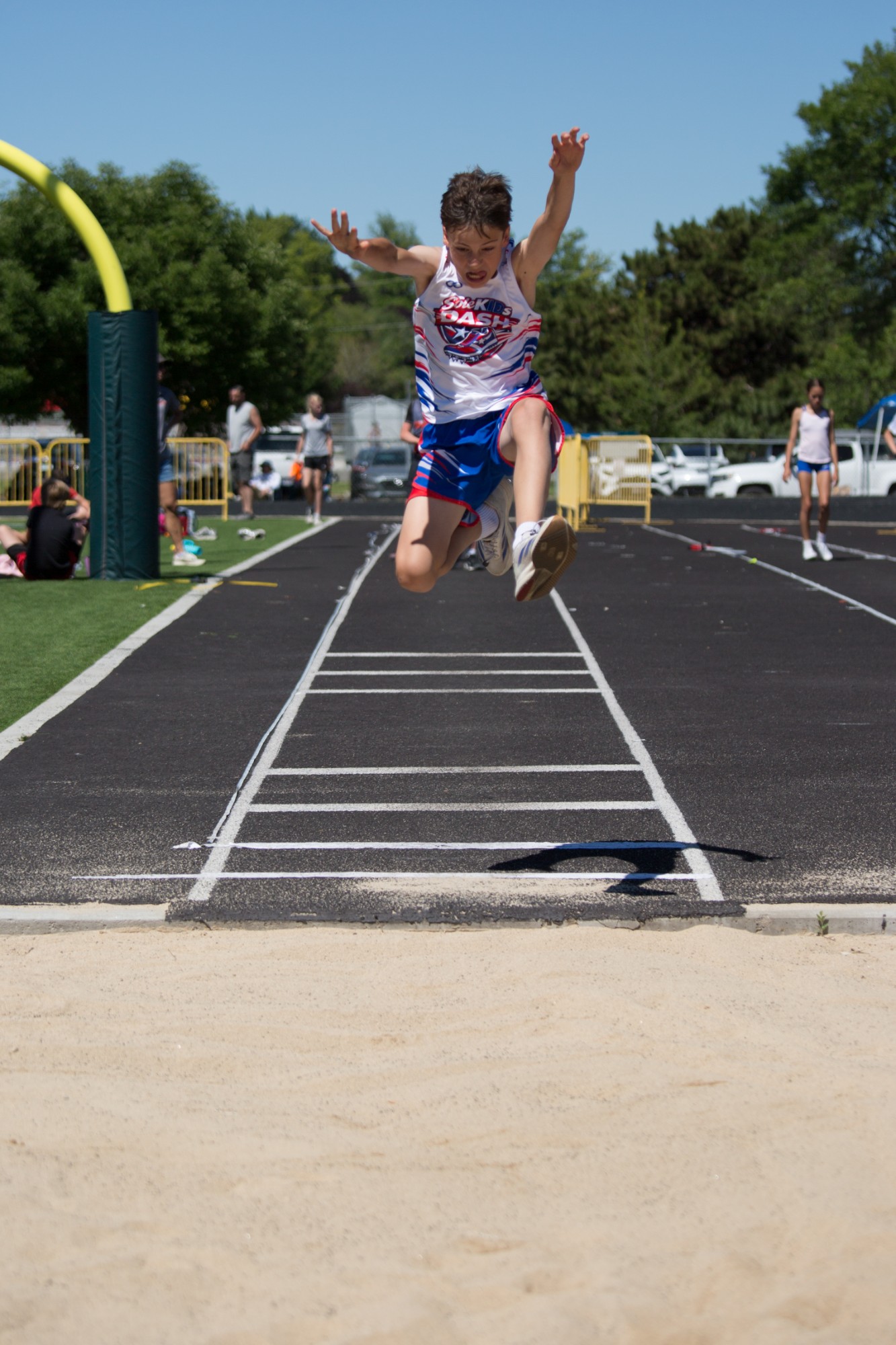 A DASH athlete competing in the long jump